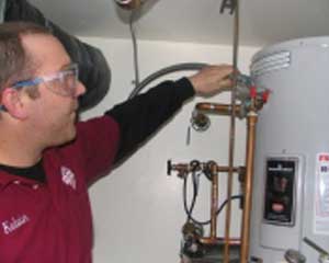 Ralph is doing a maintenance check on a heater unit